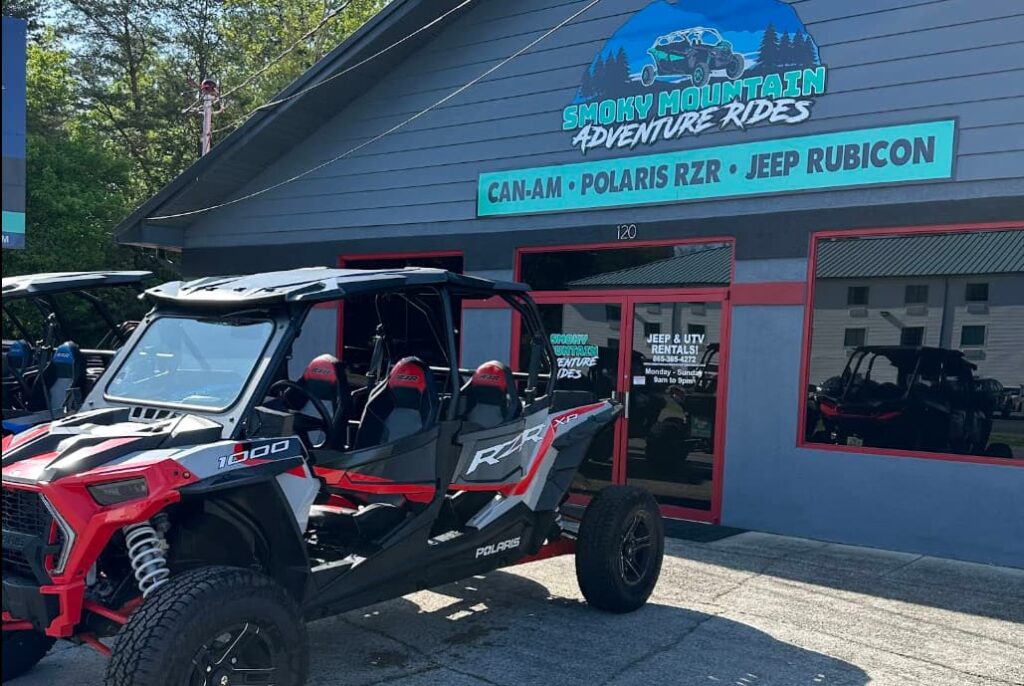 Smoky Mountain Adventure Rides store in Pigeon Forge with an RZR on display outside