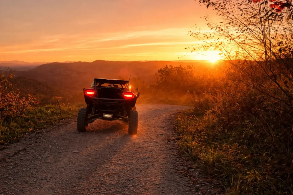 Full day UTV rental in Pigeon Forge kicking up dust at sunset in the Smoky Mountains